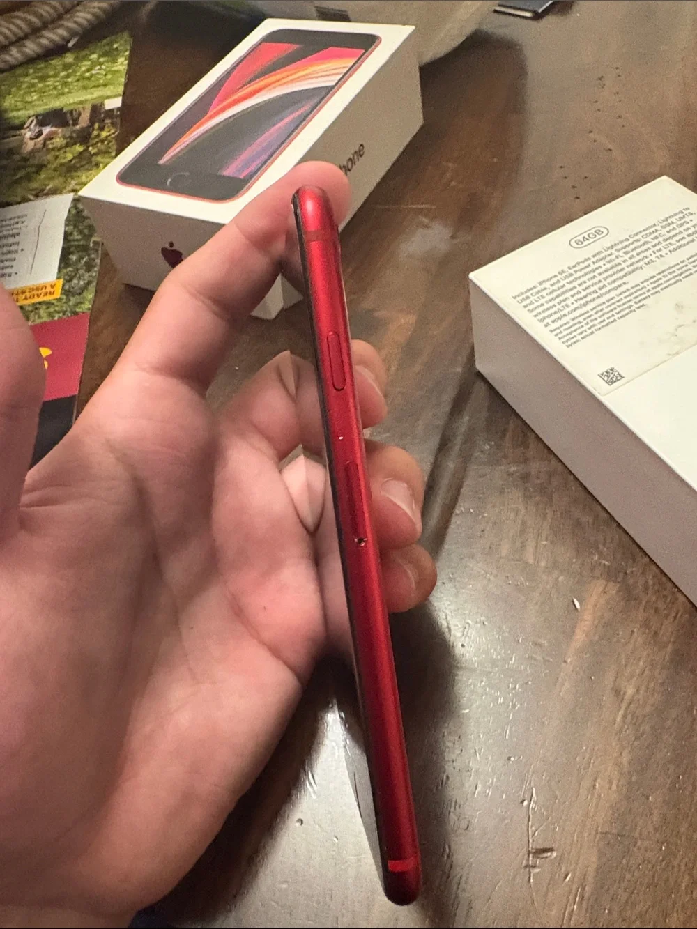 Apple iPhone SE in Red - Compact Touch ID Smartphone, Tiny crack in back.